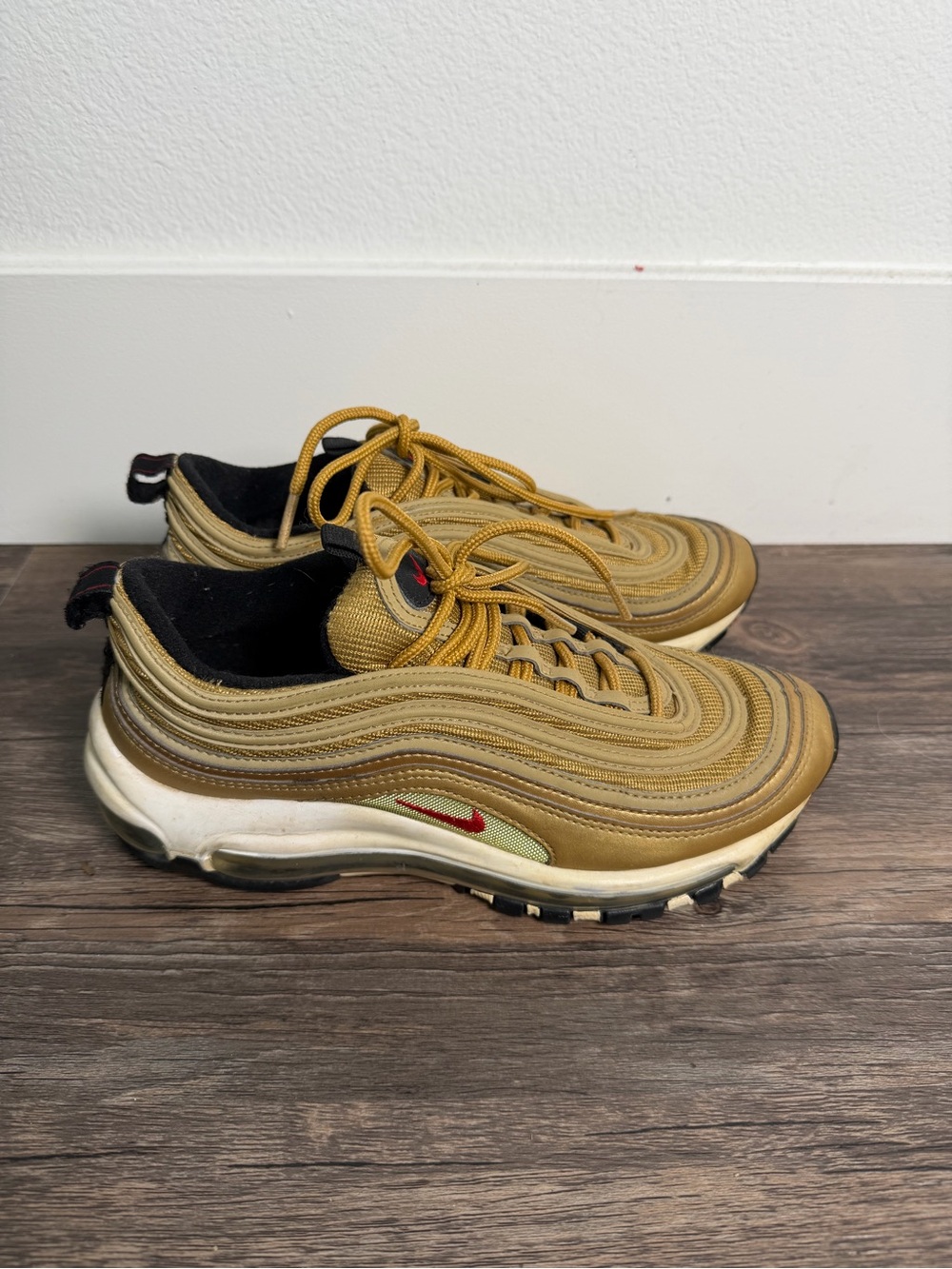 Nike Sneakers in Gold with Red Swoosh